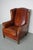This cognac-colored leather club chair comes from the Netherlands. It is upholstered with cognac-colored leather and...