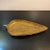 Italian, mid-century modern, art pottery, leaf-shaped tray or dish with gilt crackle textured surface and glazed black...
