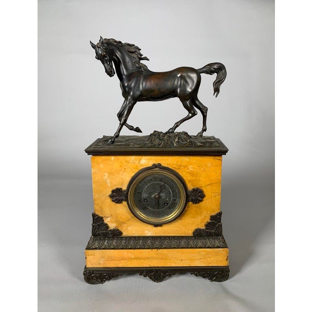 Charles X style horse clock in Siena yellow marble, 19th century Restoration For Sale