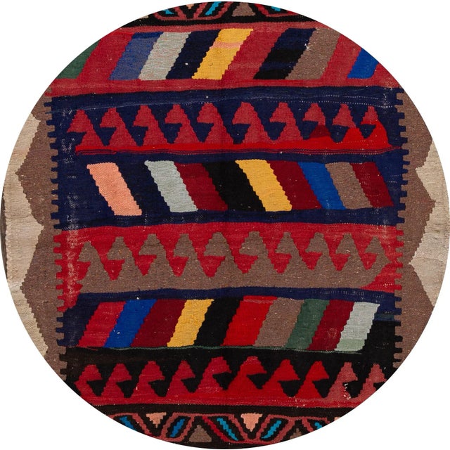 A beautiful hand-woven vintage Kilim runner with a tan field, and multi-color accents an all-over geometric design. This...