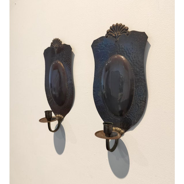 Pair of Swedish hand-made brass candle sconces. Early to mid 20th. Aged almost bronze-like patina. Stamped "Knut Eriksson"...