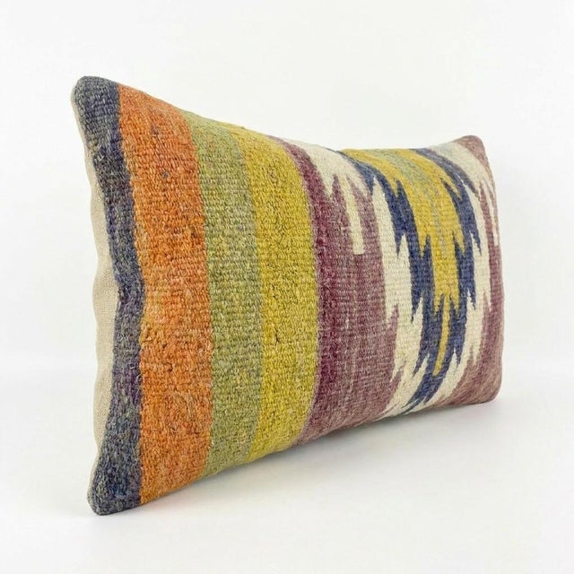 This beautiful 14'' x 20'' hand-woven Kilim pillow cover was made from an authentic Turkish kilim. The traditional flat-...