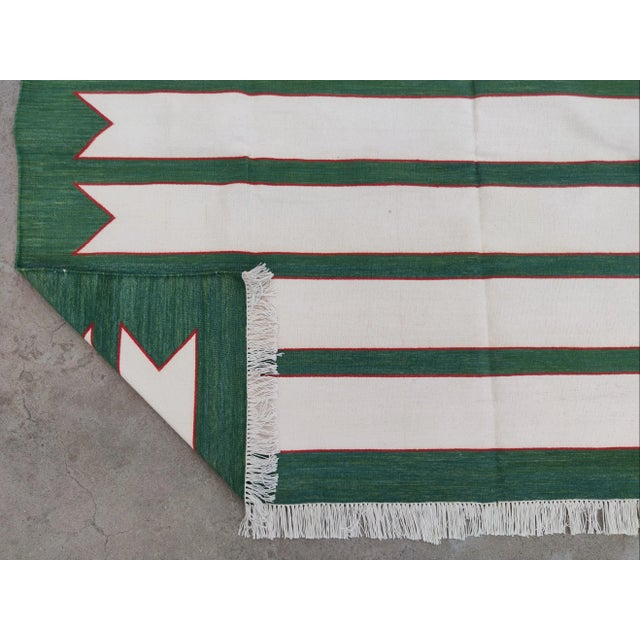 Casa Cosima Handmade Green and Red Geometric Border and Cream Fringe Cotton Rug For Sale - Image 4 of 11