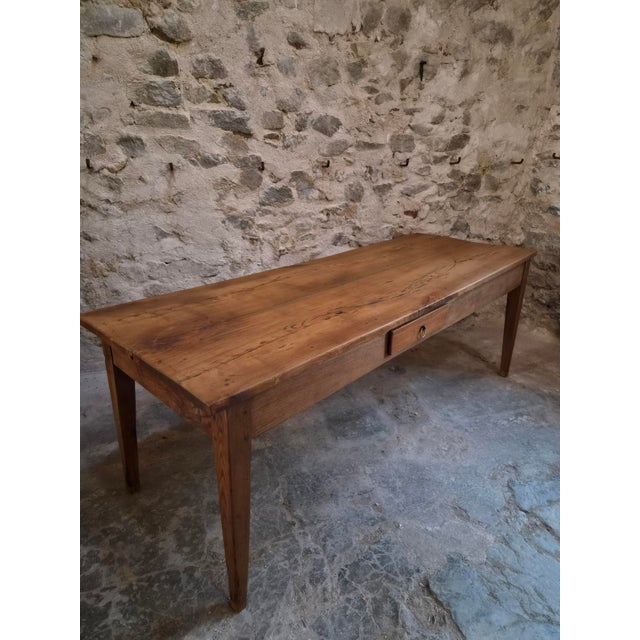 Large antique French farmhouse dining table dating from the 18th century. The table is constructed predominantly from...