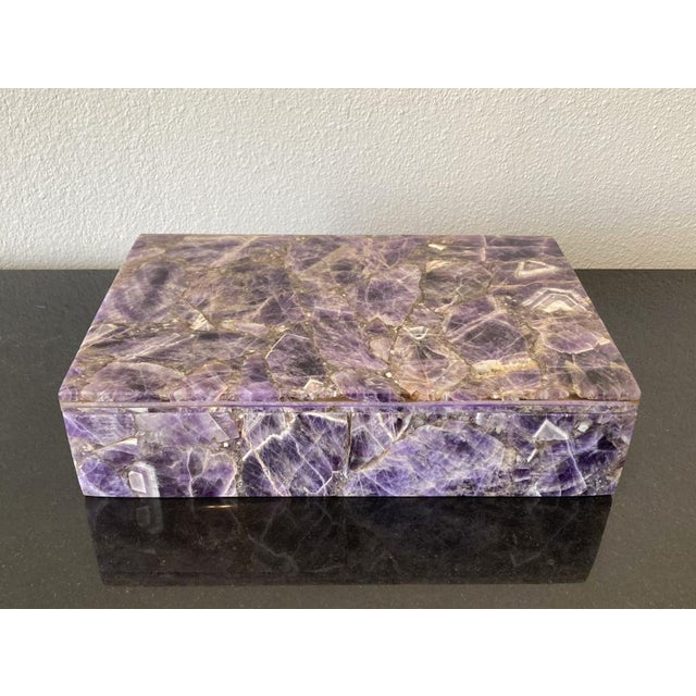 The Amethyst box is a sleek and simple design that is accentuated by its construction of amethyst gemstone chips . The...