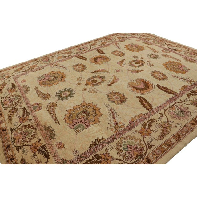 Hand knotted in wool originating from India circa 1890-1900, this 10x12 antique rug represents a rare large-size Agra rug...