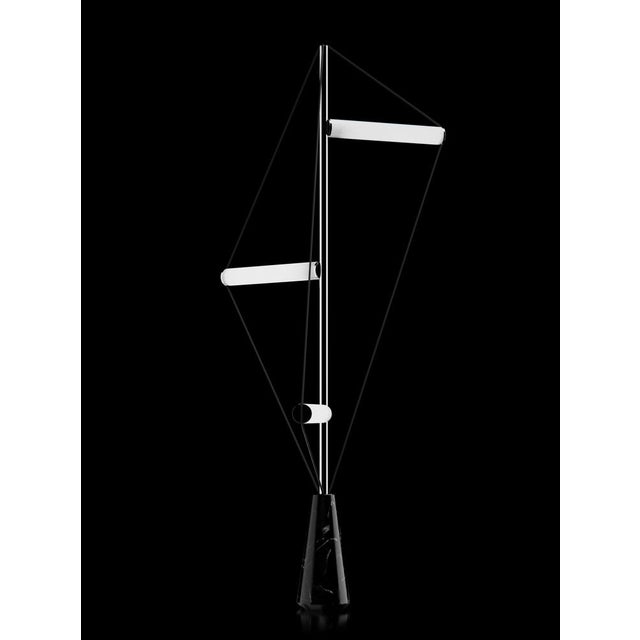 Floor lamp with Marquinha black stone base, chrome structure and frosted light tubes. European Plug (up to 250V).