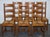 An elegant set of six French ladder-back dining chairs from the 1950s, expertly crafted in solid oak with hand-woven rush...
