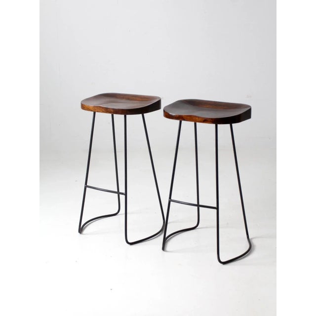 Pair of Vintage Sculpted Wood Saddle Seat Bar Stools With Black Iron Bases For Sale - Image 11 of 11