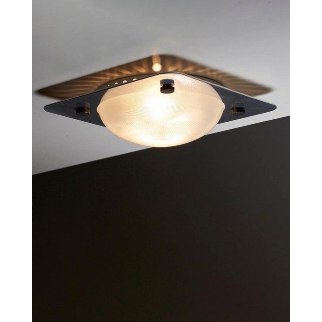 The chrome plate elegantly cradles the textured glass, creating a vibrant and captivating lighting effect. Enhance the...