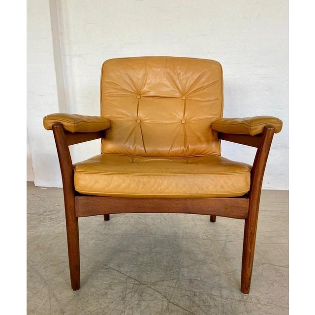 A handsome vintage Scandinavian lounge chair by Swedish manufacturer Göte Möbler, dating from the 1970s and combining...