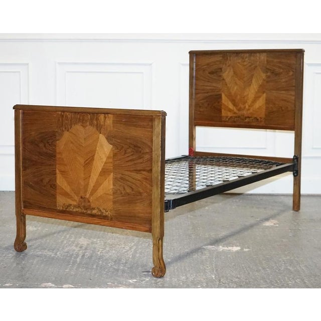 Art Deco Single Bed. A stunning design characterised by its richly textured burr walnut wood, exuding elegance and...