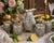 A vintage Indian hand-chased repoussé beverage service comprising a matching pitcher and six tumblers, crafted in silver-...
