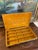 This vintage jewelry case features a striking patterned exterior in warm tones of brown, black, and gold, paired with a...