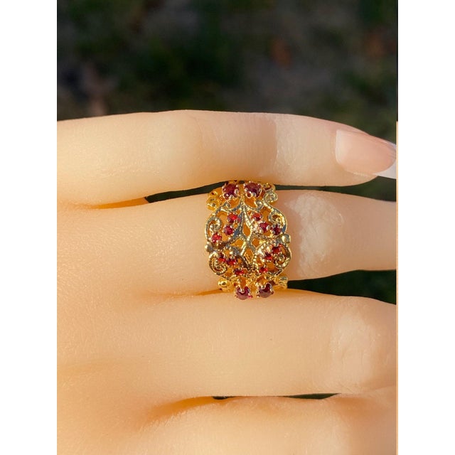 The Kingsessing Ladies 18K Gold Cocktail Ring set with Garnets. Beautifully crafted in 18 karat yellow gold, this ladies...