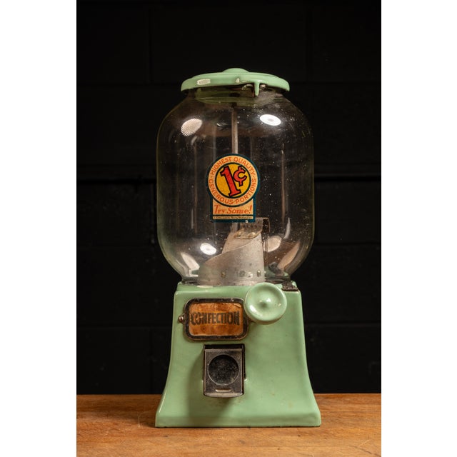 c. 1950s; The Northwestern Corp. - Morris, IL Vintage porcelainized cast iron confection vending machine. This piece,...