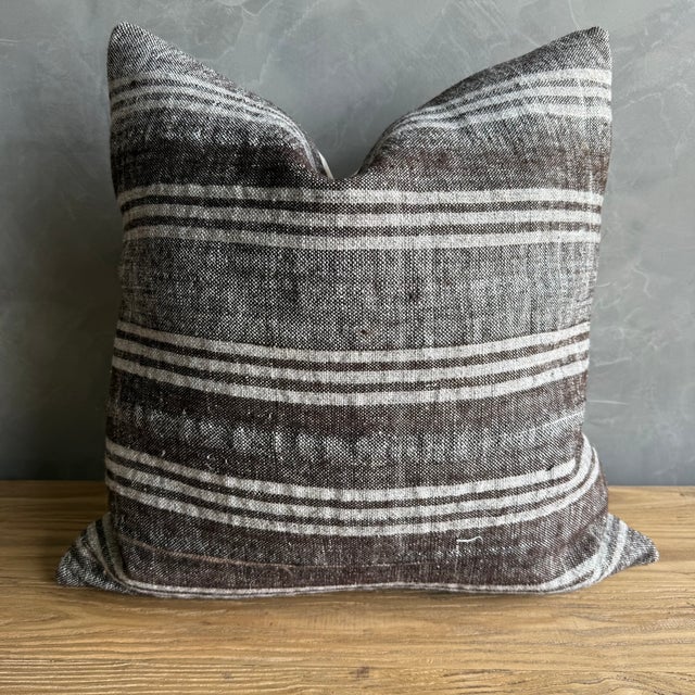 Creamy white hemp rug pillow with stripes. Soft hand, linen blend backing with zipper closure. Spot cleaning is...