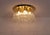 Circular ceiling light made up of a beveled solid brass base supporting 4 rows of crystal drops, original edition from the...