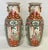 Elegant pair of mid century Asian Famille Rose signed porcelain vases. Each has four panels depicting various Asian...