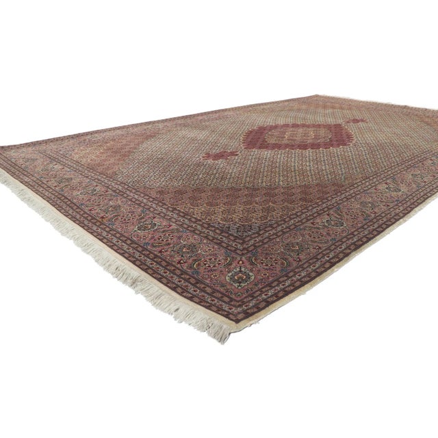 77368 Vintage Persian Tabriz Rug, 06'07x 10'06. Step into a realm of enduring beauty with this hand-knotted wool and silk...