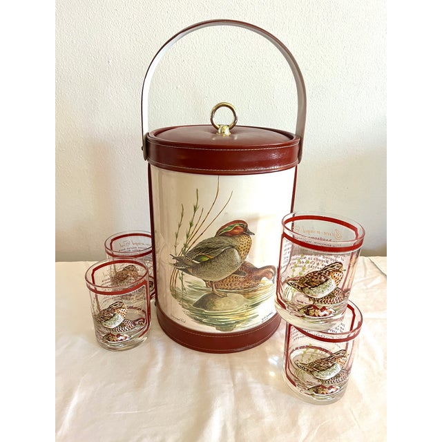 This vintage barware ensemble features illustrations by W. D. Gaither of Green-Winged Teal ducks perched on a rock in a...