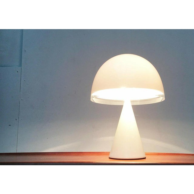 Rare table lamp from the Italian manufacturer Guzzini. The mushroom -shaped lamp screen is made of translucent acrylic...
