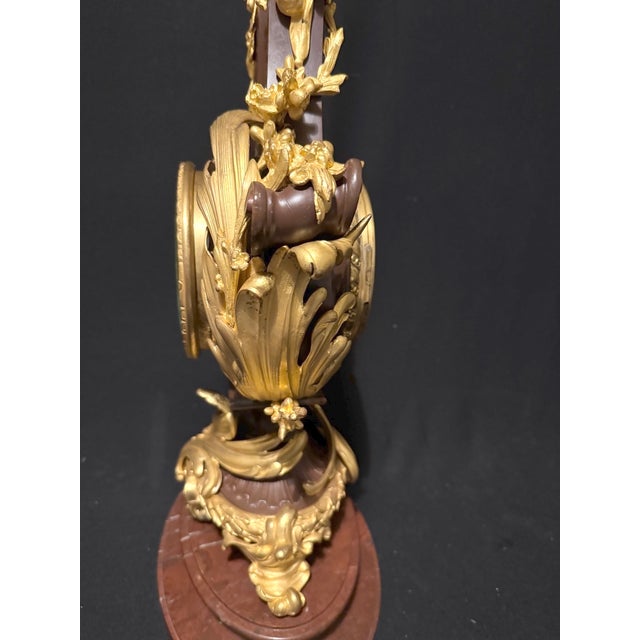 19th-Century French Louis XVI Lyre Clock (1840–1860) – Bronze with Patina & Ormolu, Marble Base (1 Piece) This exquisite...