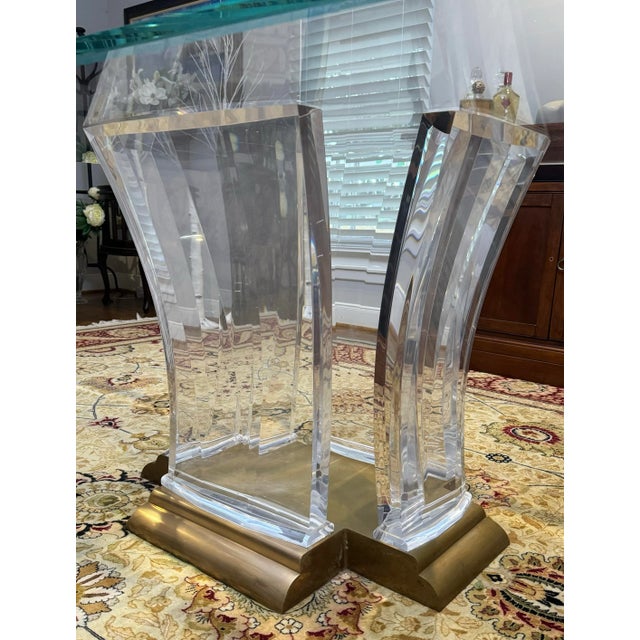 Jeffery Bigelow acrylic and bronze dining table. Dimensions - Height: 28 in. (71.12 cm) Width: 33 in. (83.82 cm) Depth: 25...