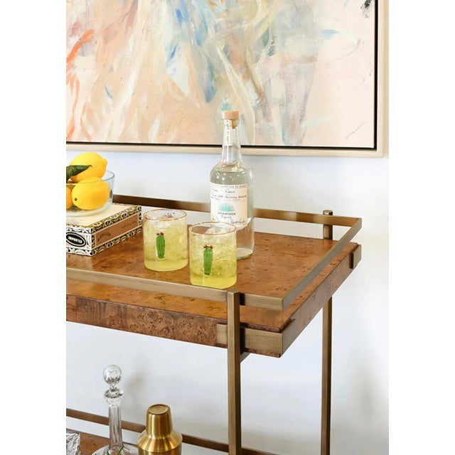 Gorgeous Dark Burlwood and brass bar cart. Wood has natural variations and may differ slightly between panels. 34" W X 34"...