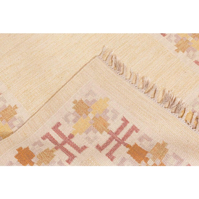 Vintage Swedish Flat Woven Rug by Fredrik Fiedler Size: 4'5" × 6'8" (134 × 203 cm) Color: Beige, Gold, Lavender, Pink,...
