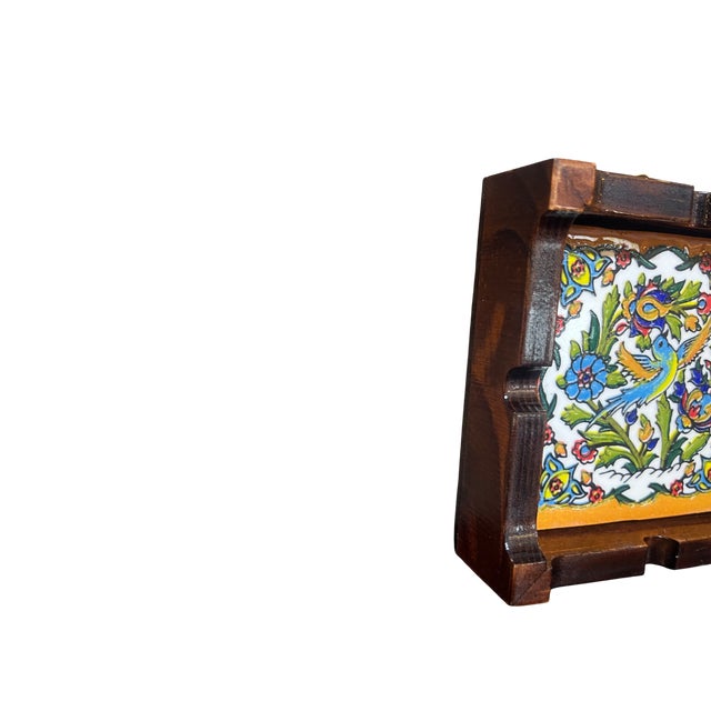 Discover the perfect fusion of functional barware and traditional artistry with this Handmade Ceramic and Wood Ashtray....