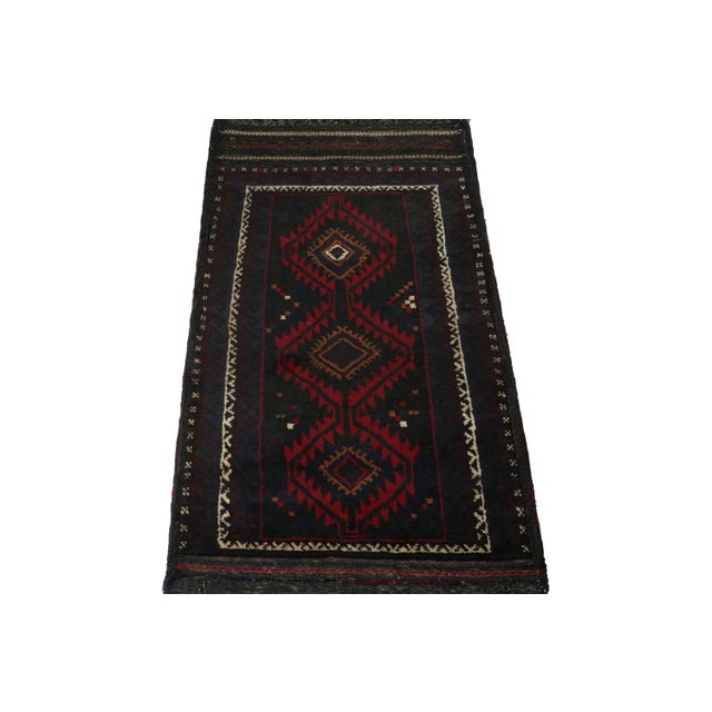 Hand knotted in wool, this 6x8 Baluch rug represents a new line of tribal carpets in the Modern Classics Collection by Rug...