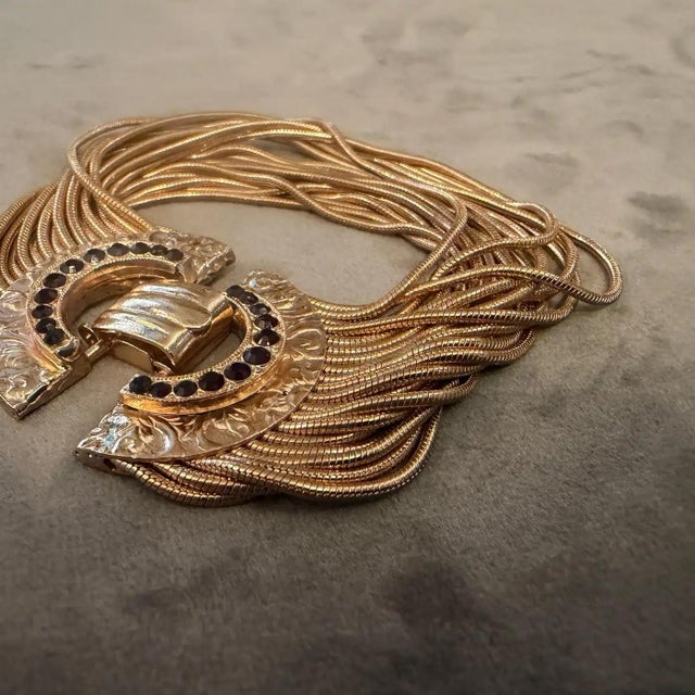 This stunning vintage Italian bracelet from the early 2000s is a masterclass in maximalist costume jewelry. Designed with...