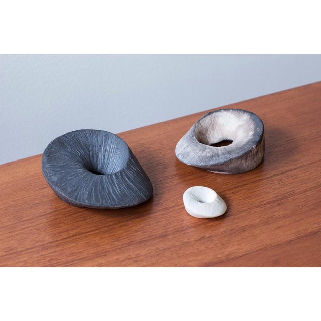 Set of three stoneware ceramic pieces by unknown Danish artist. Made sometime around the 1960-70s. The pieces mimic the...