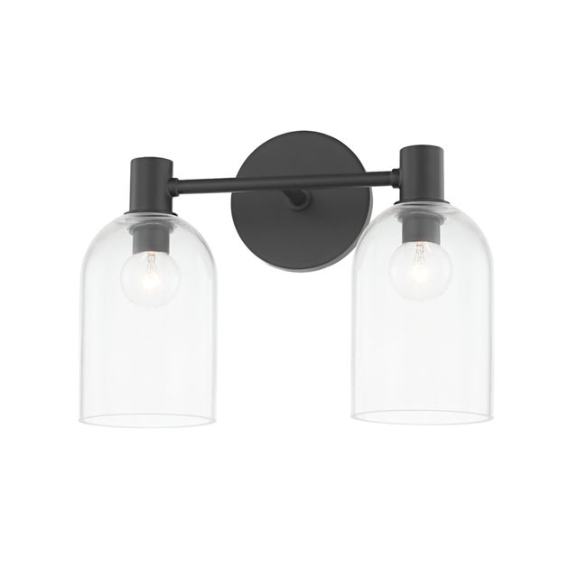 Drawing inspiration from antique glass bottles, a cloche-like shade in clear glass showcases a single bulb nested at the...