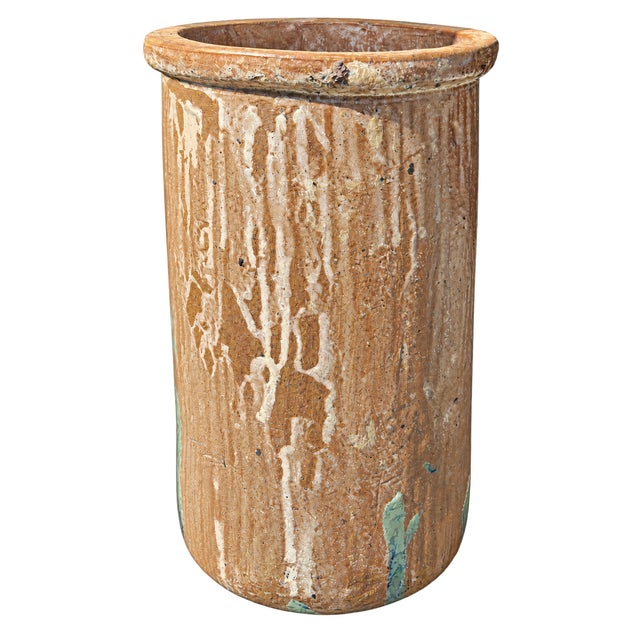 Large antique hand-thrown terracotta storage jar dating to approximately the late 19th or early 20th century. This...