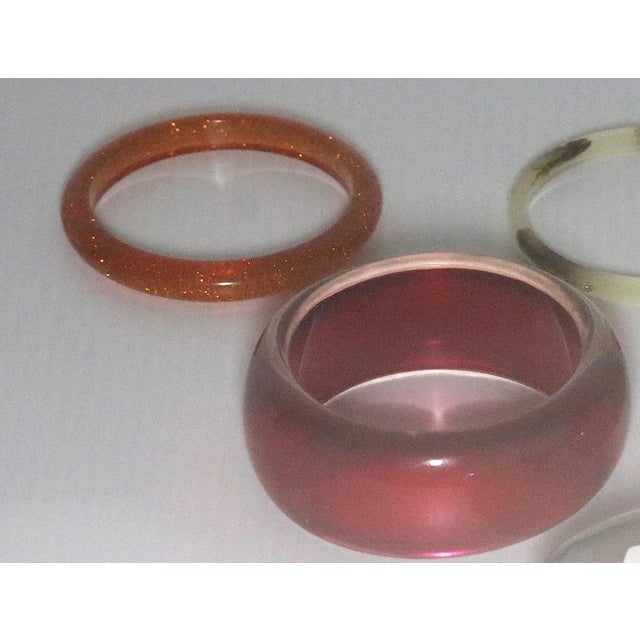 This is part of Chairish’s Costume Jewelry assortment. A Collection of 5 Bangle Thermoplastic or other Bracelets-2...