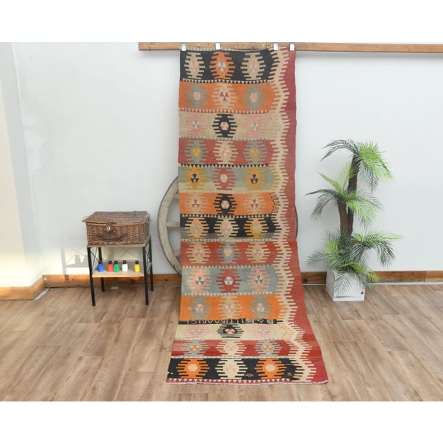 Vintage Turkish Hand-Knotted Kilim rug is a semi-antique vintage area rug. The '70s Eastern region of Anatolian's unique...