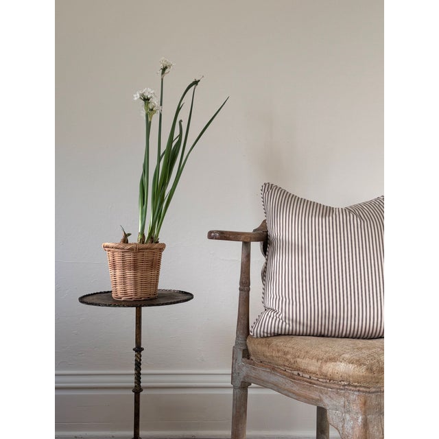 Custom made pillow with self welt, backed in a coordinating chocolate cotton. Hidden zipper at back. Fabric: Ian Mankin...