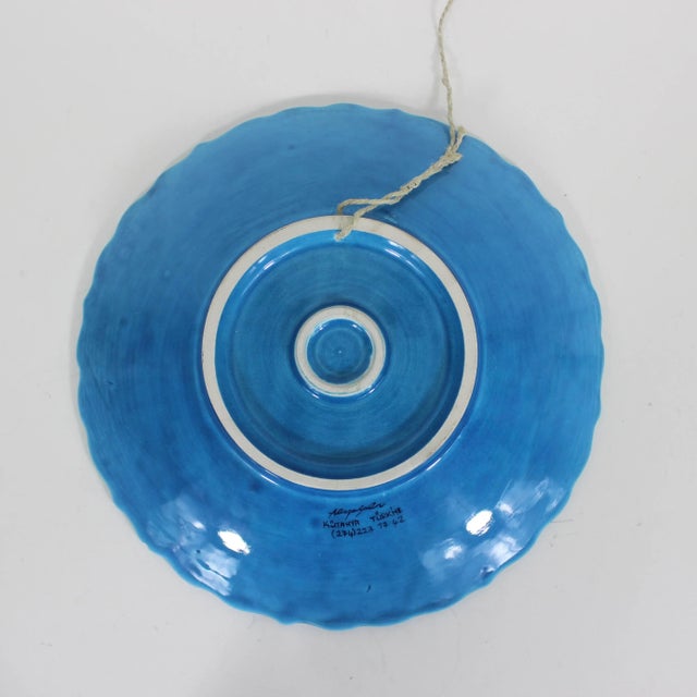 This is a stunning vintage Turkish ceramic wall plate, hand-painted, showcasing traditional folk art. It is signed on the...