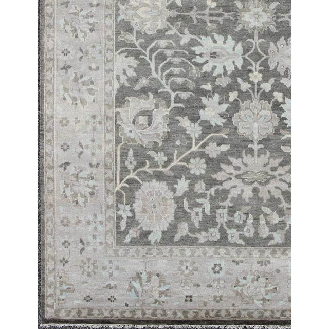This beautiful floral Oushak in anchored by Gray background and taupe border, Keivan Woven Arts rug , country of origin /...