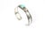 Sterling Silver and Opal Cuff Bracelet A sterling silver cuff bracelet featuring an oval opal cabochon in a smooth bezel...