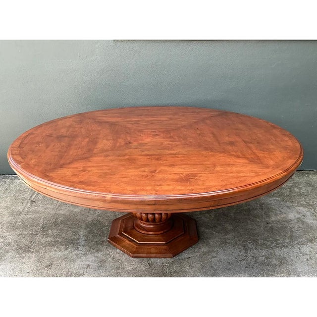 A vintage custom monumental pedestal dining table crafted from richly grained hardwood. The expansive 81.75-inch diameter...