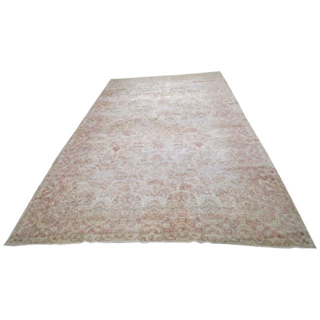 Hand-knotted with care using traditional rug-making techniques, this wool rug blends timeless craftsmanship with a modern...