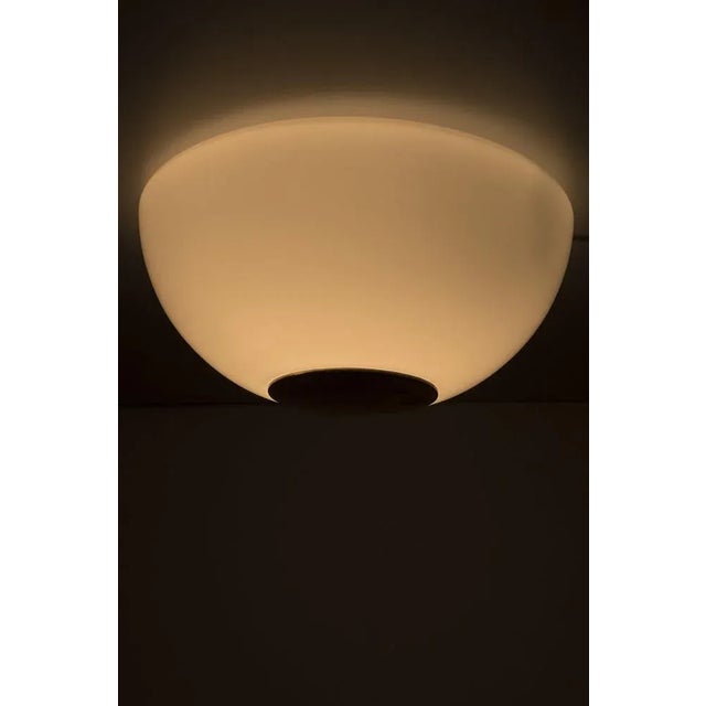 Large Limburg ceiling lamp made from glass and brass. The lamp has some traces of use but that does give it some...