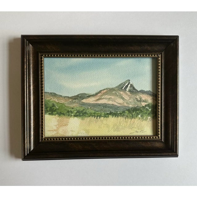 Framed watercolor painting of a mountain peak. Signed framed and ready to hang.