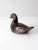 This vintage hand-carved ironwood duck figurine features sleek lines with textured detailing around the head. Its rich...