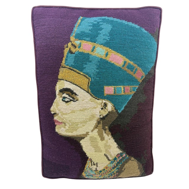 Vintage needlepoint pillow of Nefertiti and Egyptian pharaoh. Purple needlepoint with blue, gold and other colors. The...
