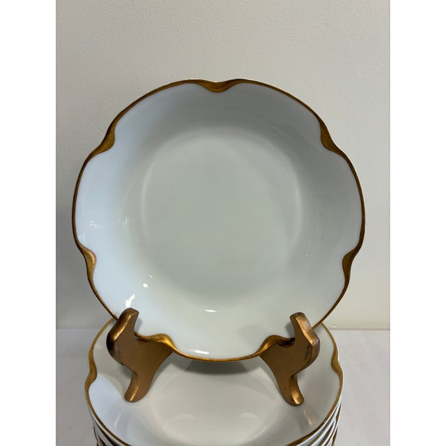 An elegant set of 10 antique Haviland & Co. Limoges porcelain bowls, each with a hand-applied gold scalloped rim and soft...
