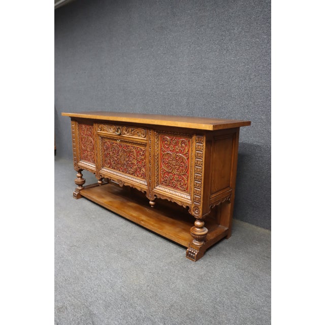 Christian Krass Renaissance Revival oak sideboard featuring elaborate carved foliate ornament, scrolling acanthus motifs,...